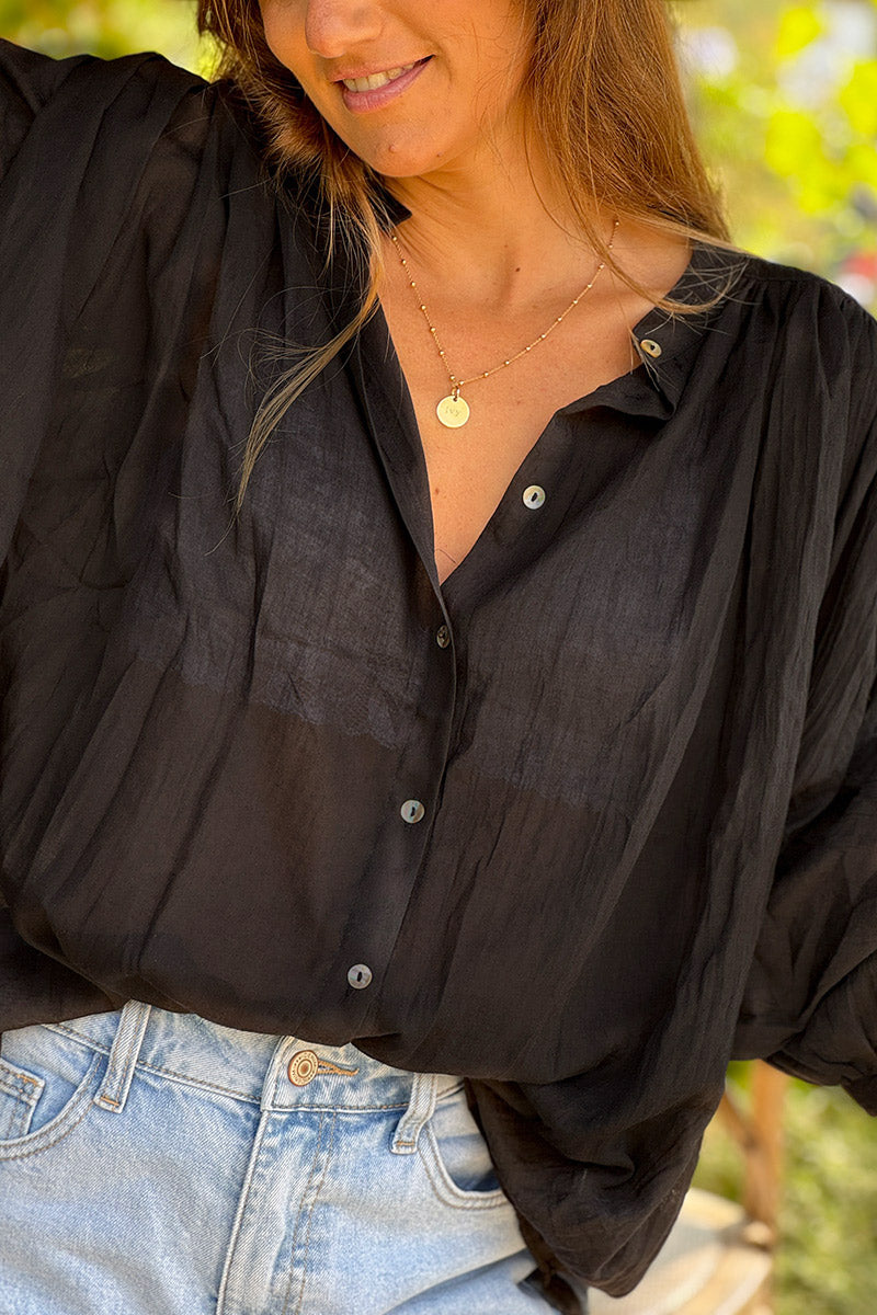 Blouse large boutonnée en voile de coton noir manches trois-quart