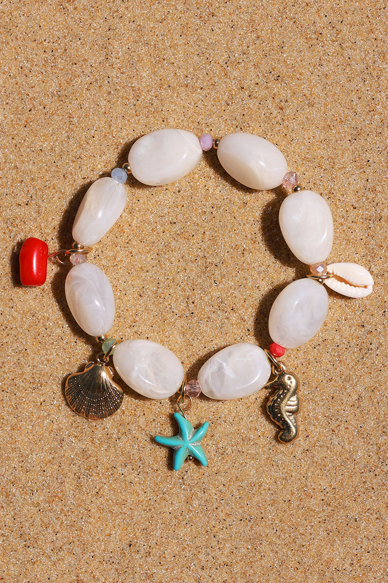 Bracelet élastique en perles résines blanches style pierres breloques plage