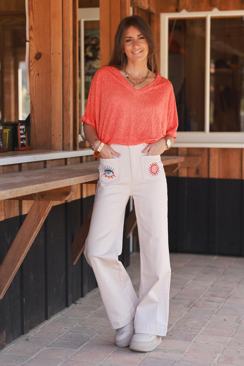 Jean beige coupe droite wide taille haute poches broderie soleil et œil