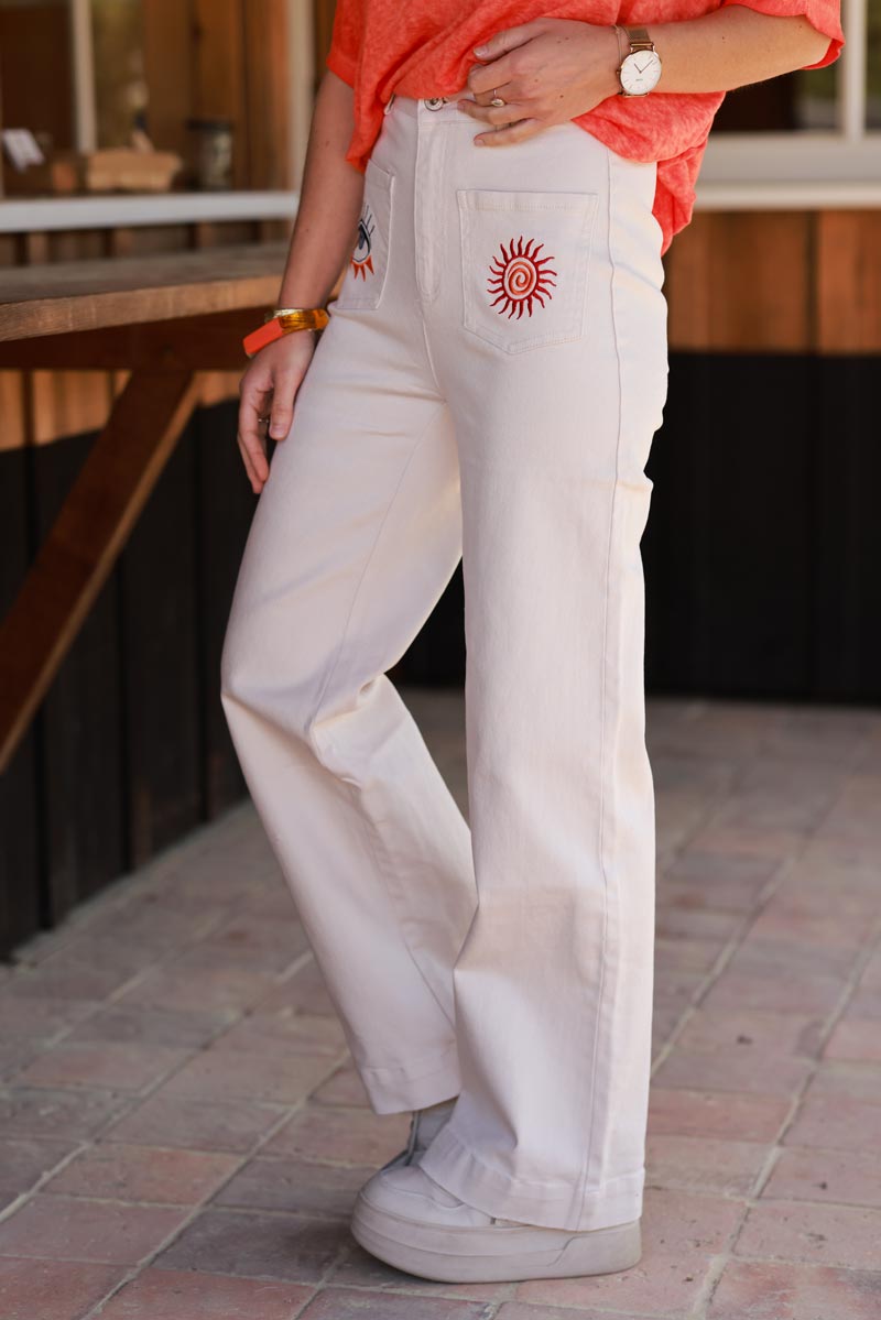 Jean beige coupe droite wide taille haute poches broderie soleil et œil