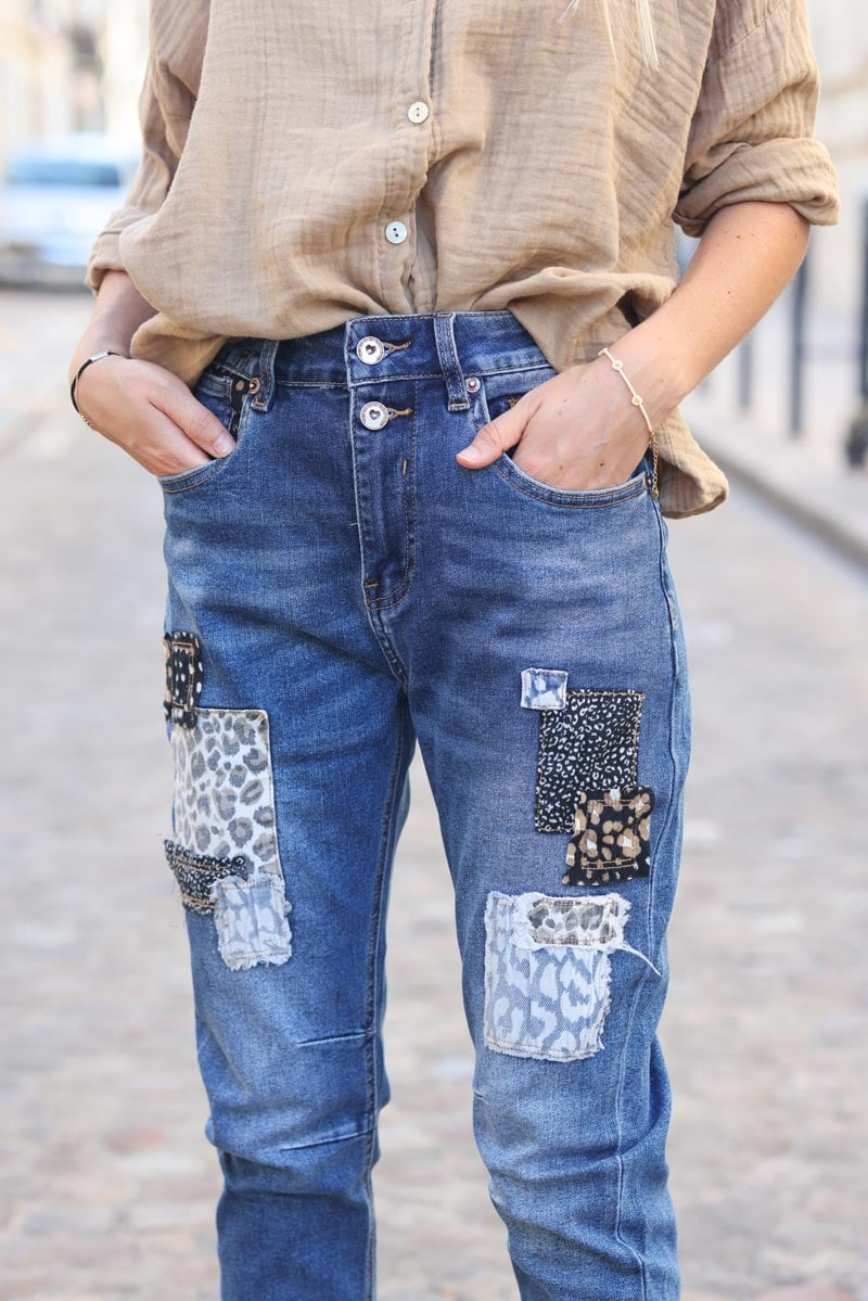 Washed baggy fit jeans with leopard print patches Horizons Lointains