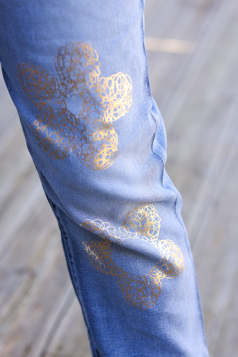 Mid-washed comfort stretch jeans with gold metallic flower print