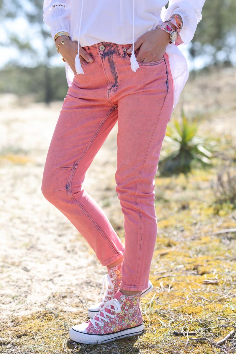 Pink high rise jeans in a washed denim