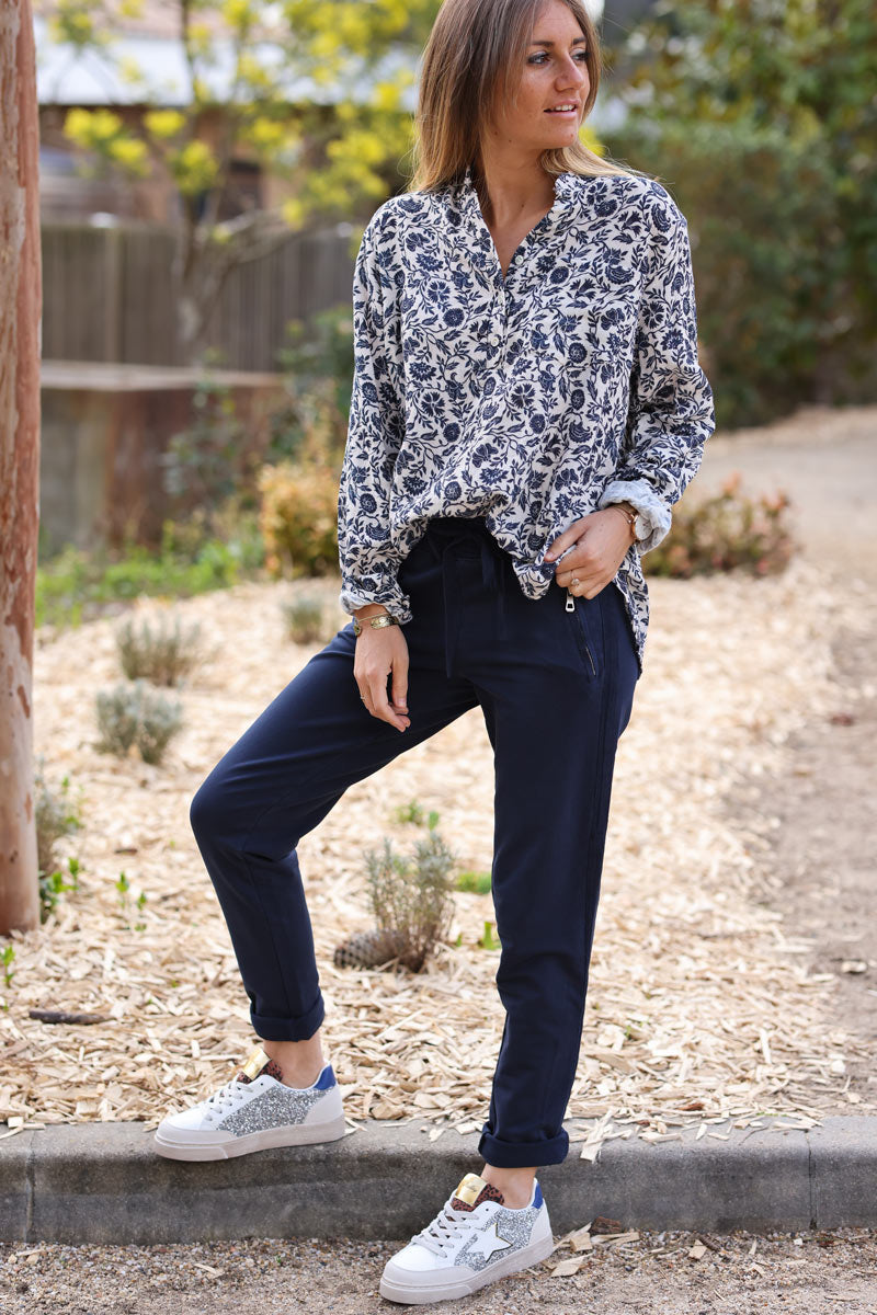 Navy blue stretch sweatpants with ribbon outseam zipped pockets