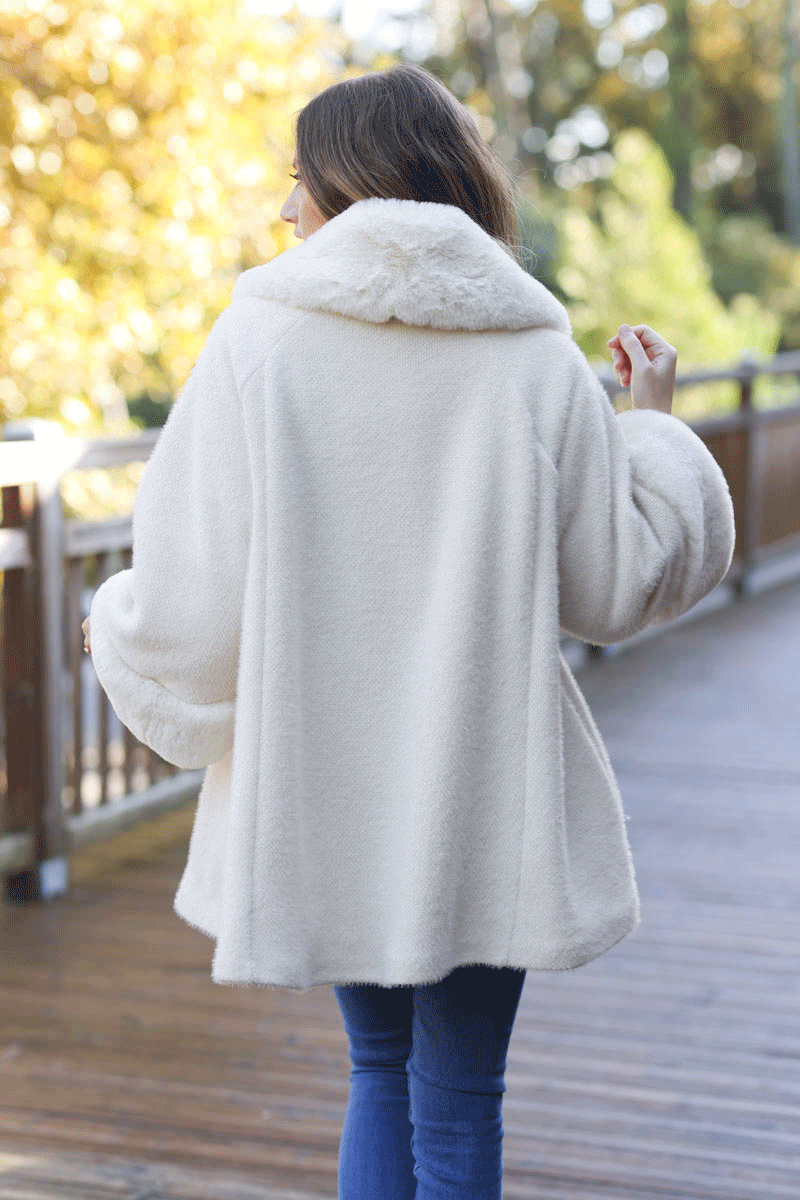 Poncho cape coat in ecru soft knit with faux fur collar and cuffs