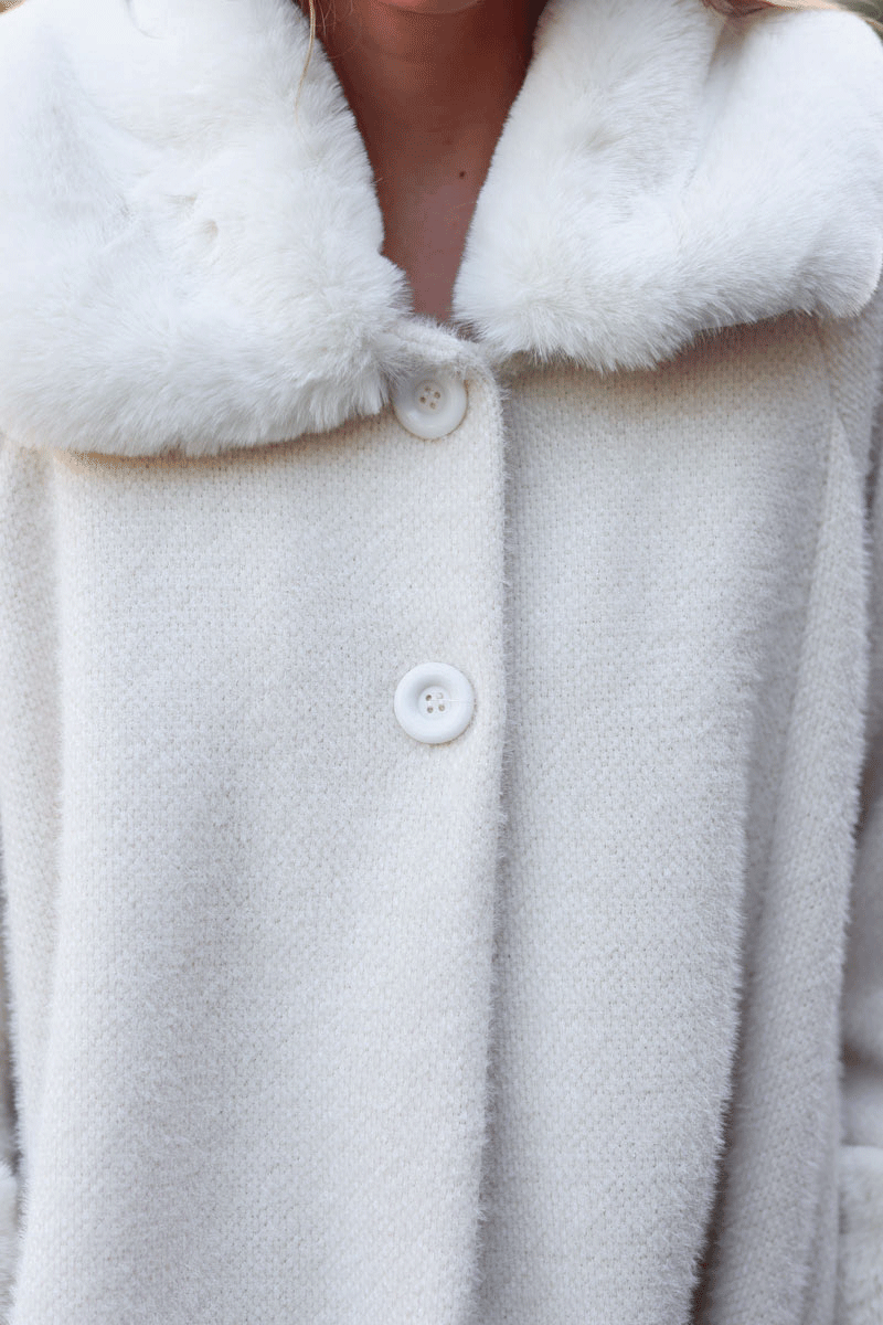 Poncho cape coat in ecru soft knit with faux fur collar and cuffs