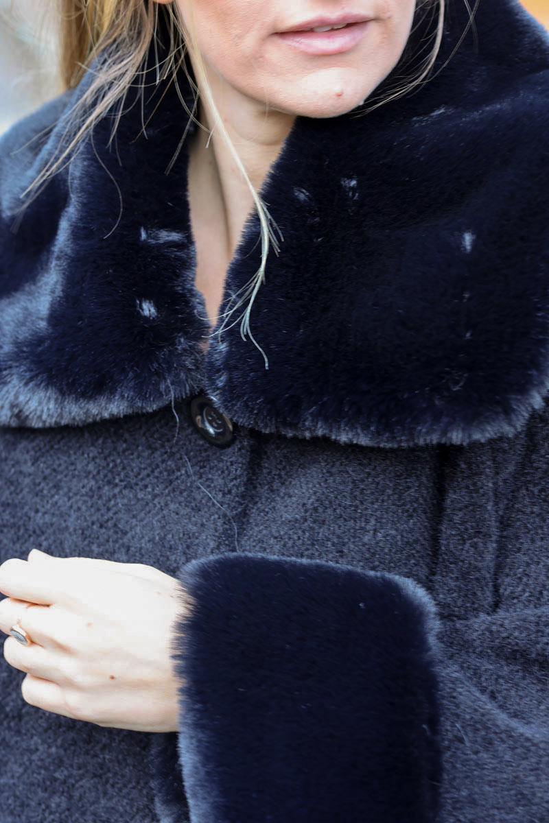 Poncho cape coat in black soft knit with faux fur collar and cuffs
