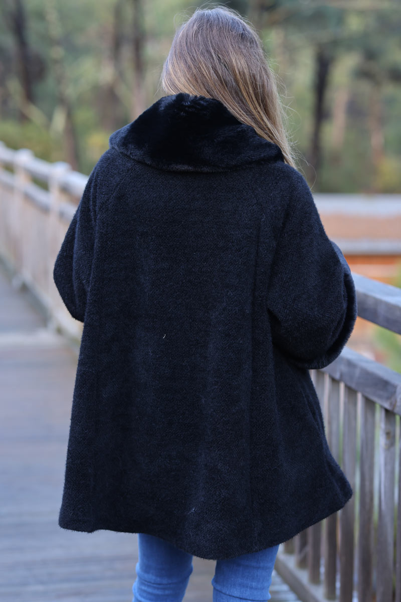 Poncho cape coat in black soft knit with faux fur collar and cuffs