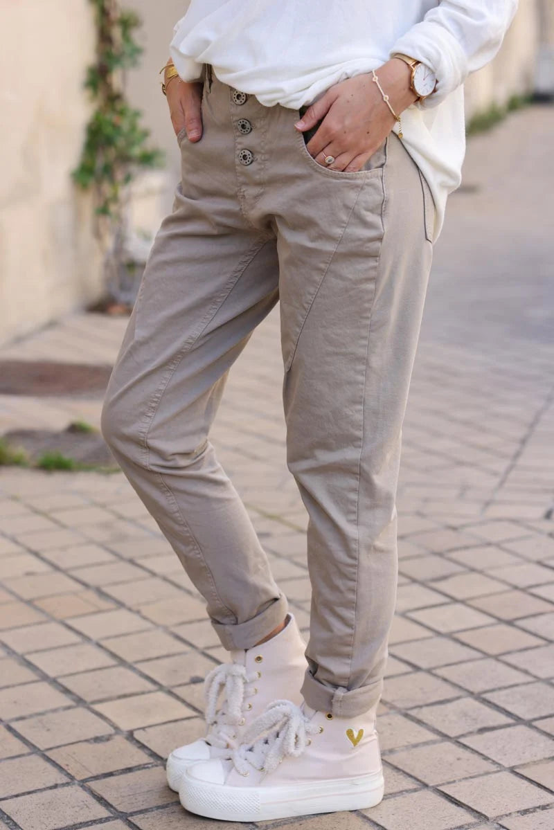 Pantalon beige bi matière toile et jersey stretch à boutons