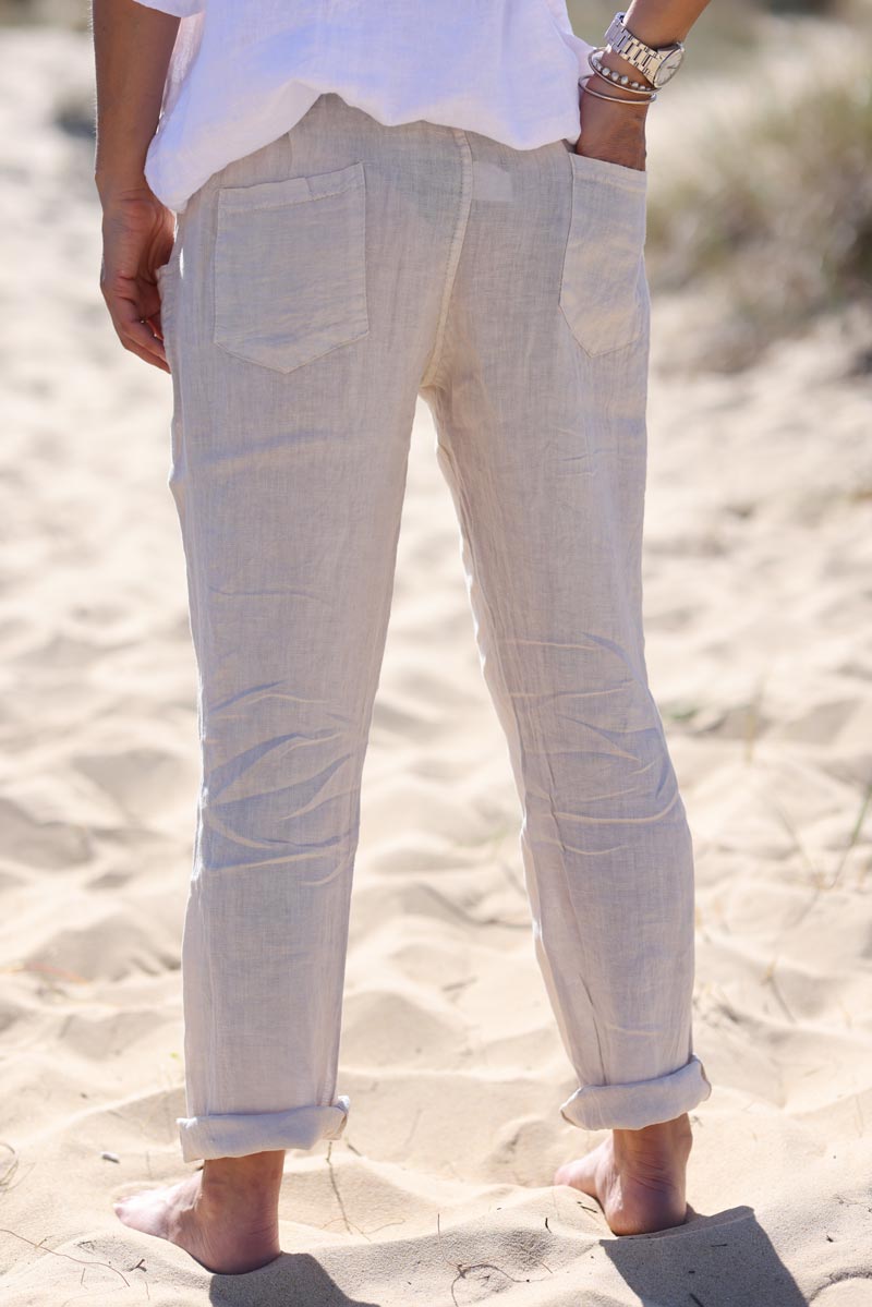 Beige linen trousers with crochet and wooden beaded belt