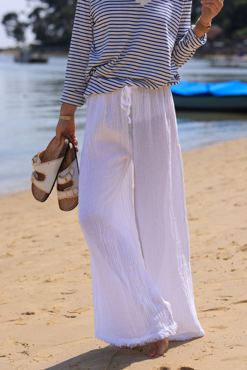 Pantalon blanc large et souple mi coton mi lin finitions franges