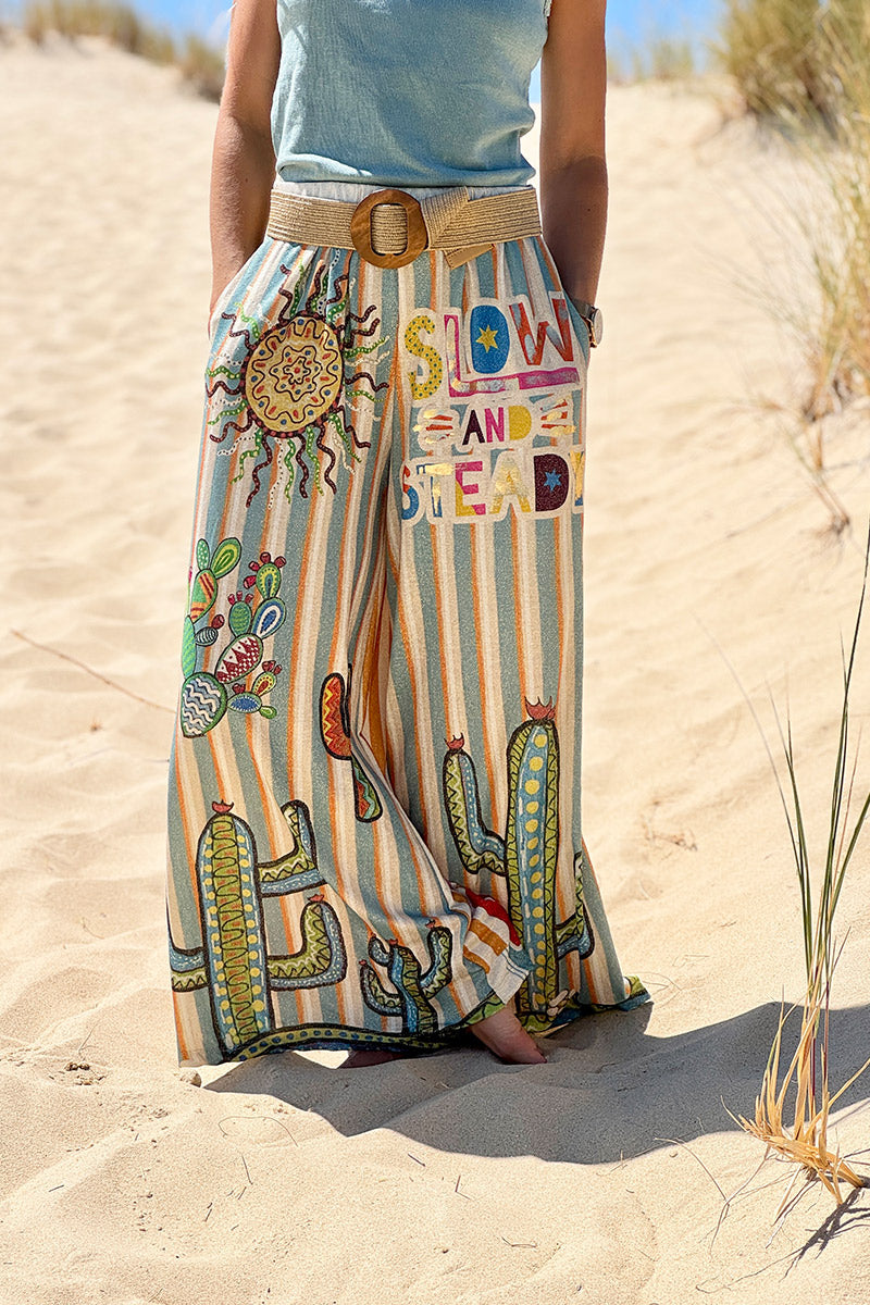 Pantalon confort et souple brillant coupe large imprimé rayures oranges et bleues soleil et cactus
