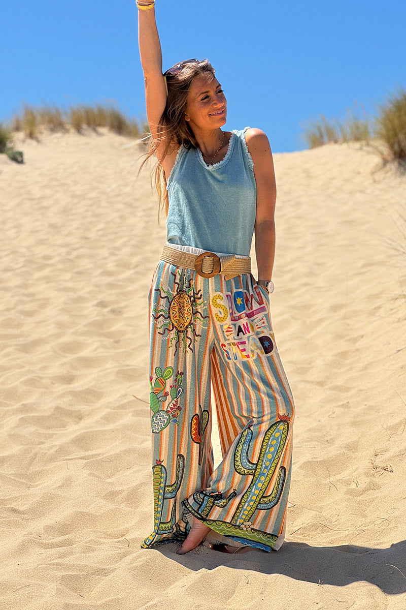Pantalon confort et souple brillant coupe large imprimé rayures oranges et bleues soleil et cactus