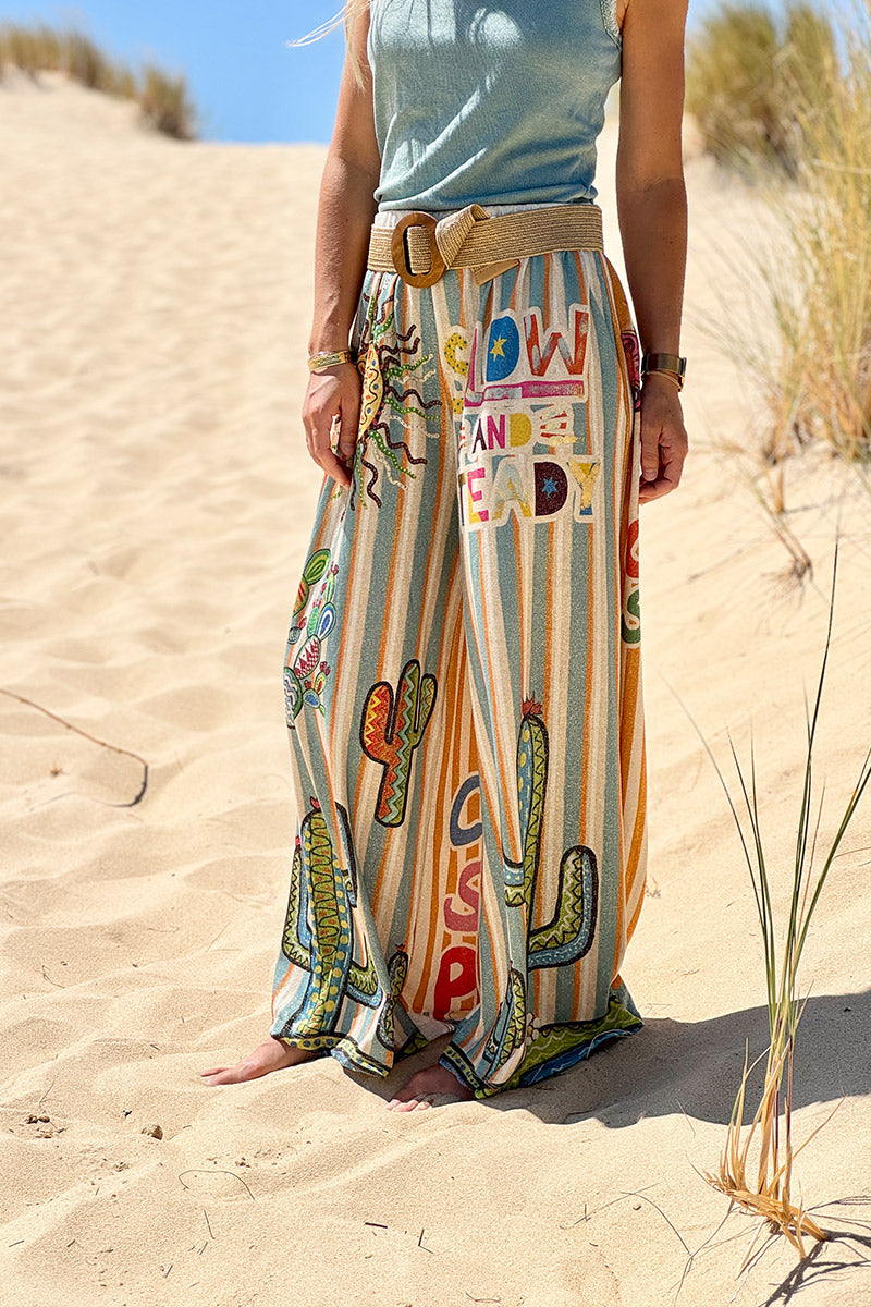 Pantalon confort et souple brillant coupe large imprimé rayures oranges et bleues soleil et cactus