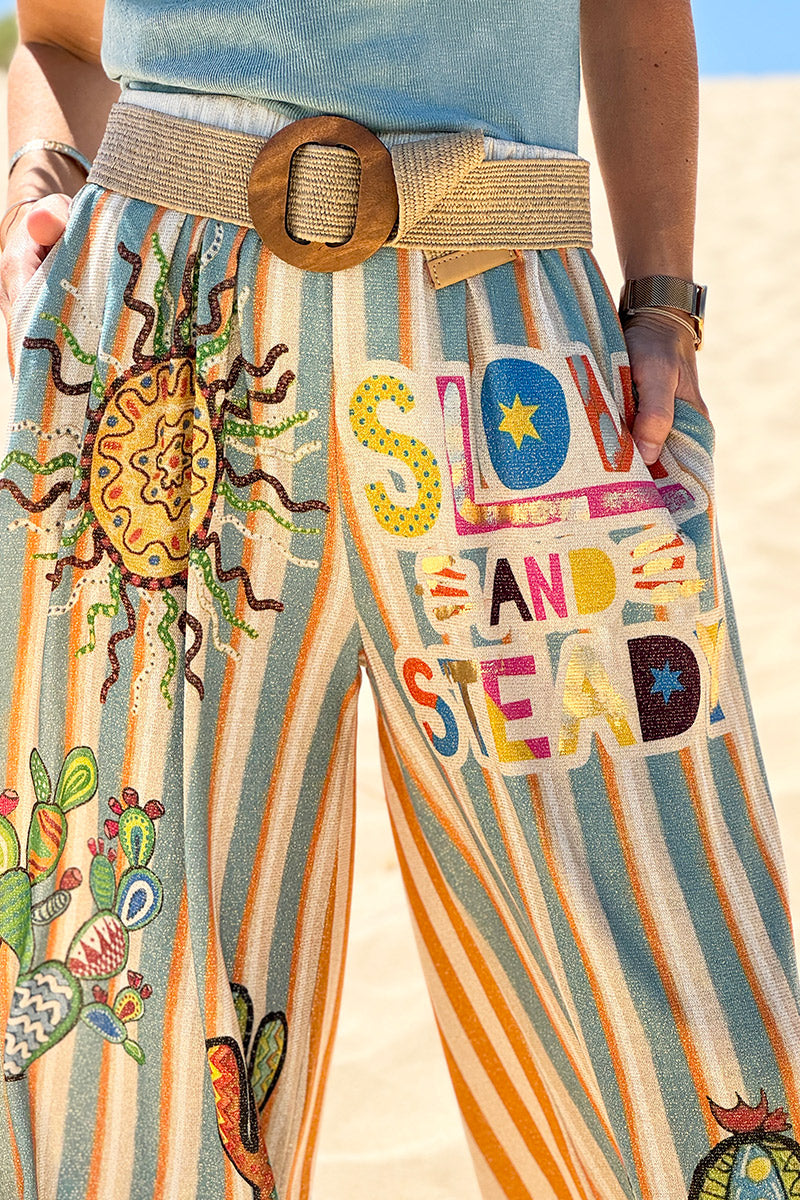 Pantalon confort et souple brillant coupe large imprimé rayures oranges et bleues soleil et cactus