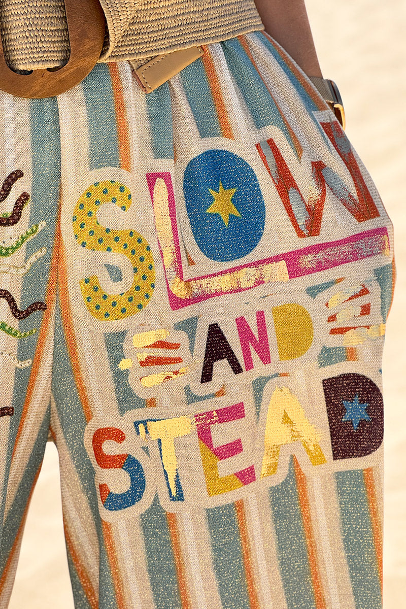 Pantalon confort et souple brillant coupe large imprimé rayures oranges et bleues soleil et cactus