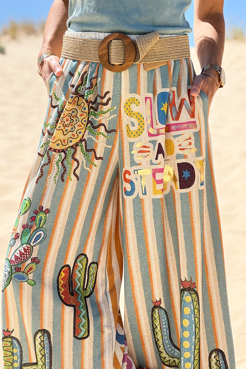Pantalon confort et souple brillant coupe large imprimé rayures oranges et bleues soleil et cactus