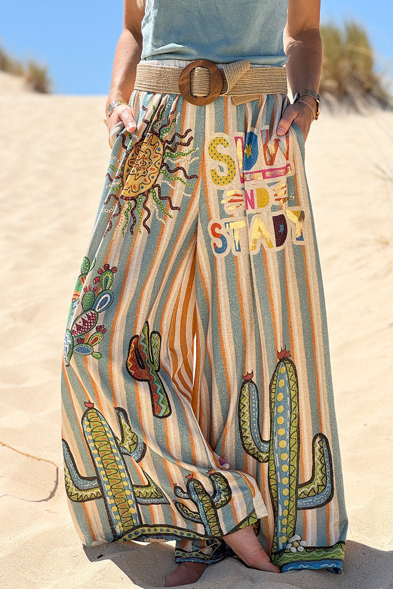 Pantalon confort et souple brillant coupe large imprimé rayures oranges et bleues soleil et cactus