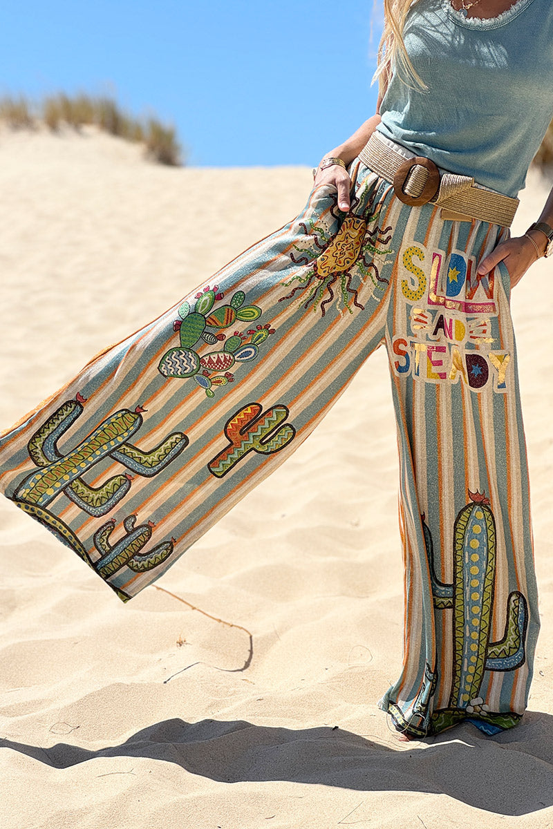 Pantalon confort et souple brillant coupe large imprimé rayures oranges et bleues soleil et cactus