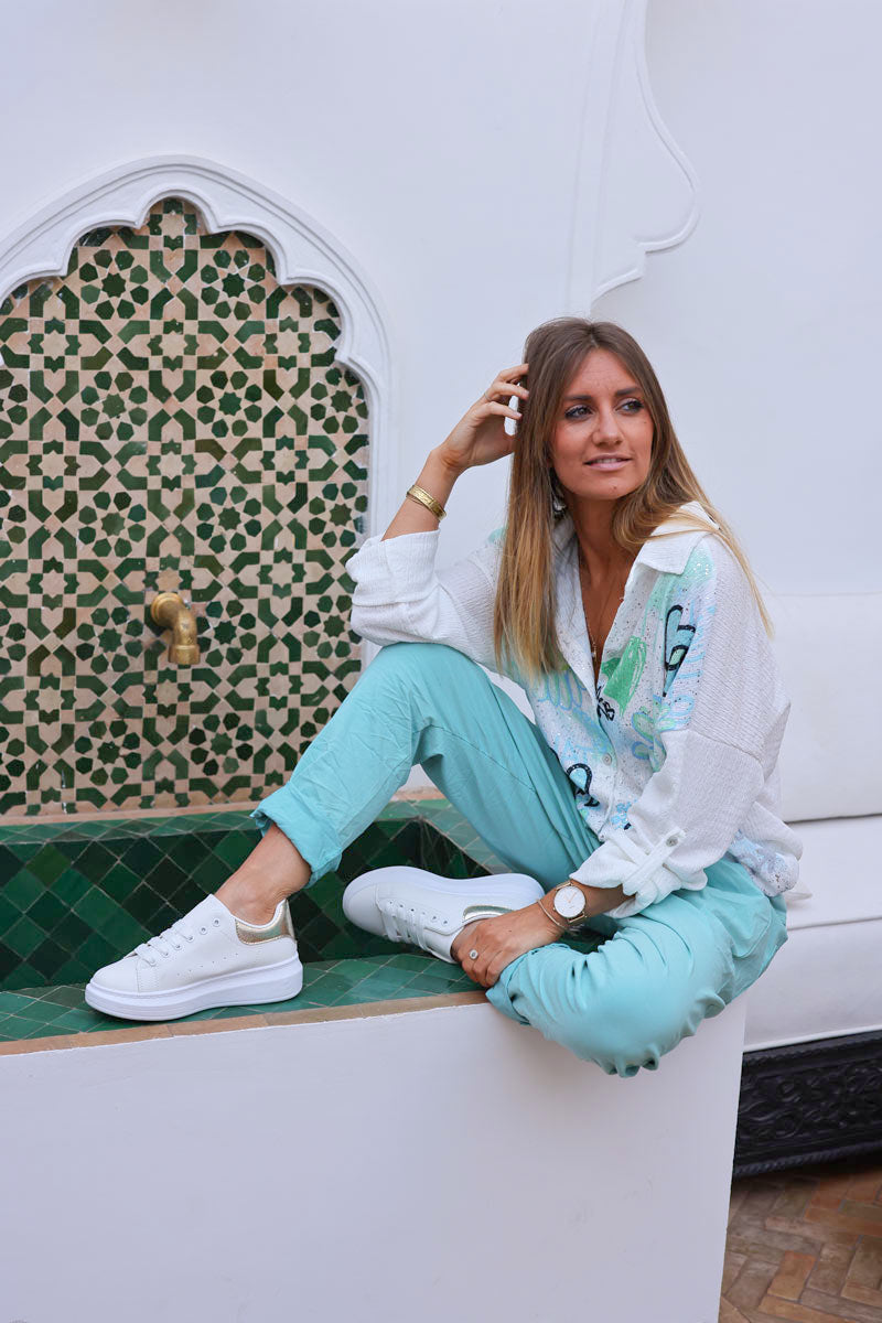 Pantalon confort turquoise en toile stretch étoile brillante paillettes