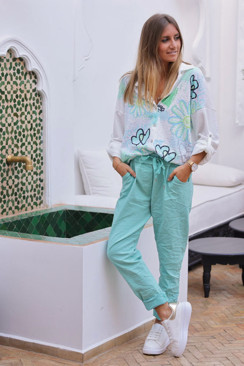 Pantalon confort turquoise en toile stretch étoile brillante paillettes