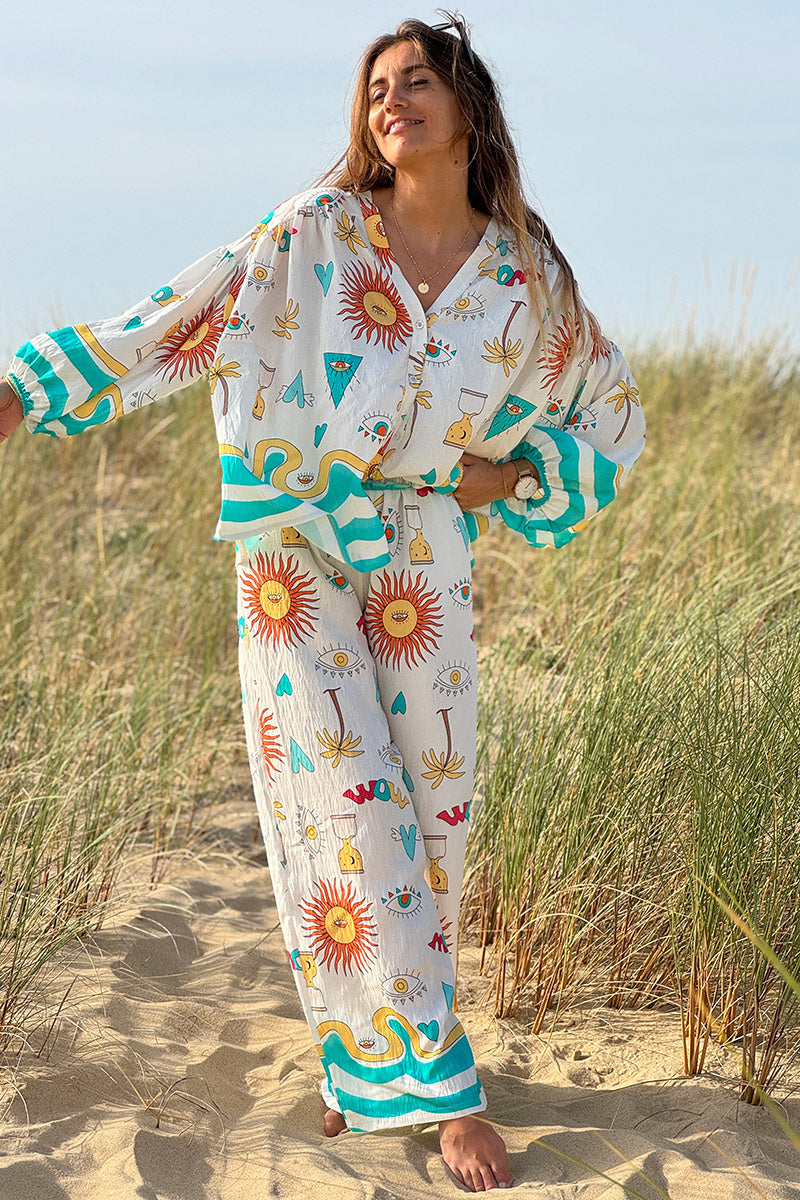 Pantalon fluide écru symboles soleil œil et cœurs colorés turquoise