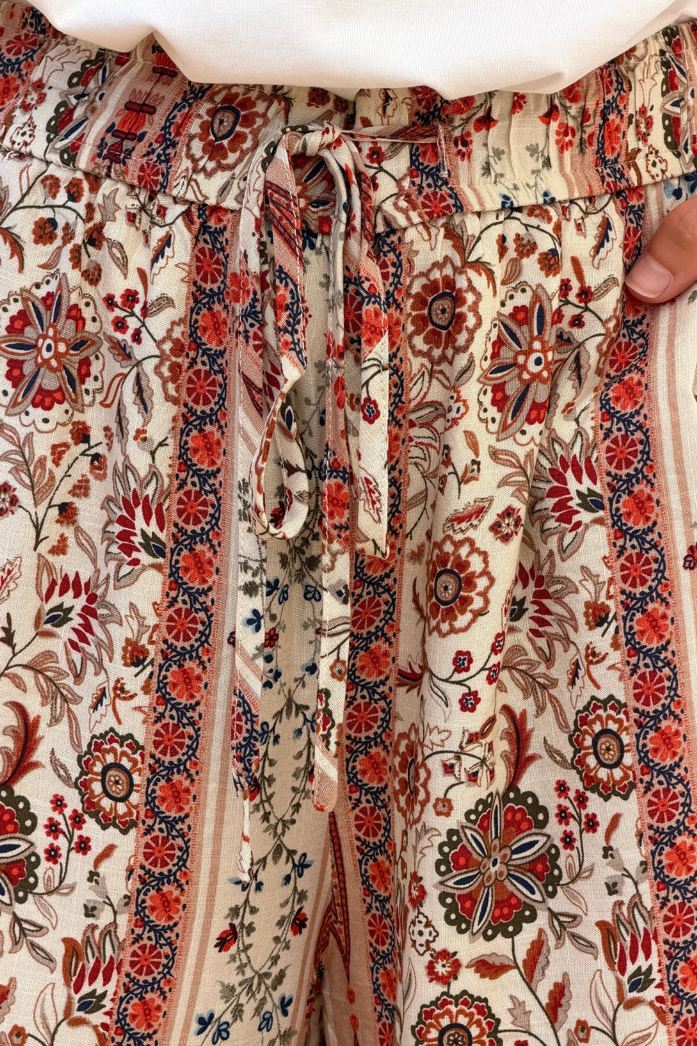 Pantalon fluide imprimé fleurs paisley terracotta effet rayures