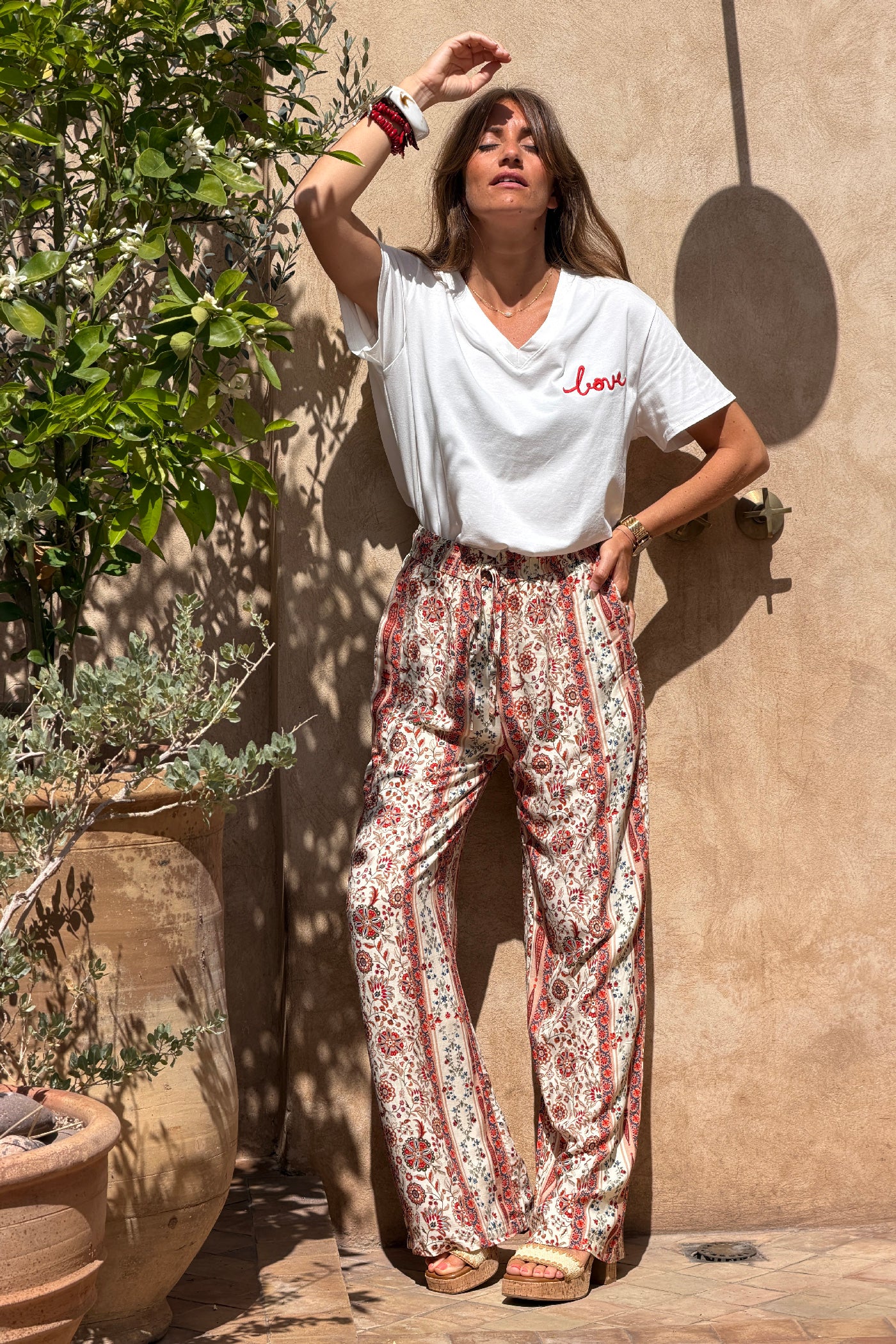Pantalon fluide imprimé fleurs paisley terracotta effet rayures