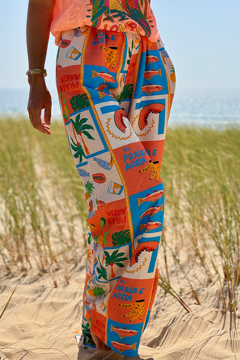 Pantalon fluide imprimé vacances d'été pastèques ananas et palmiers colorés