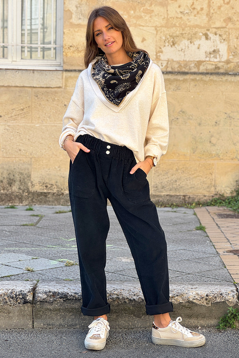 Pantalon noir en velours côtelé coupe paperbag ceinture élastique