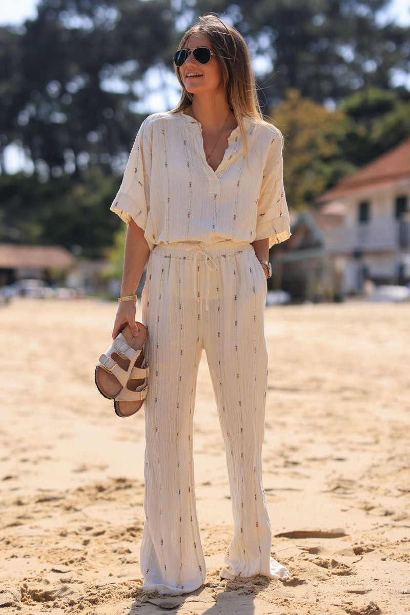 Pantalon souple en coton écru coupe évasée liserés dorés et fils multicolores
