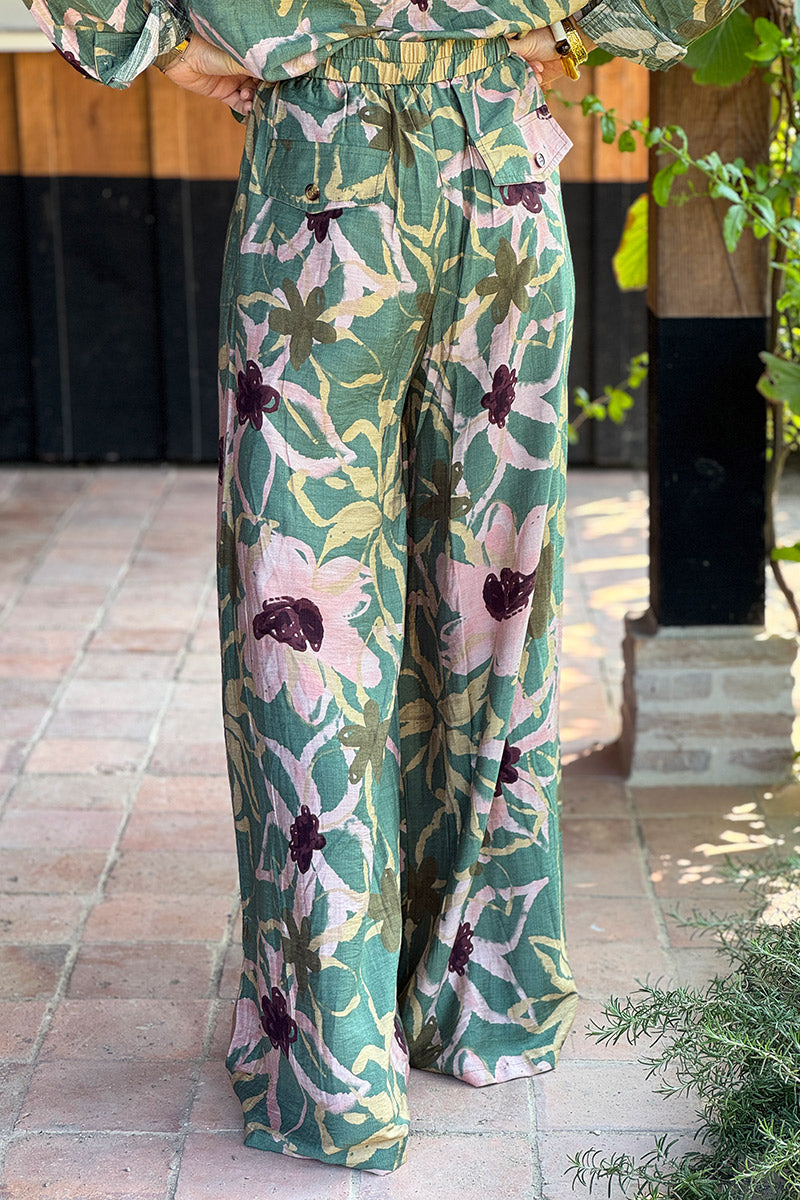 Pantalon souple vert kaki coupe wide leg avec boutons et zip motifs peinture fleurs