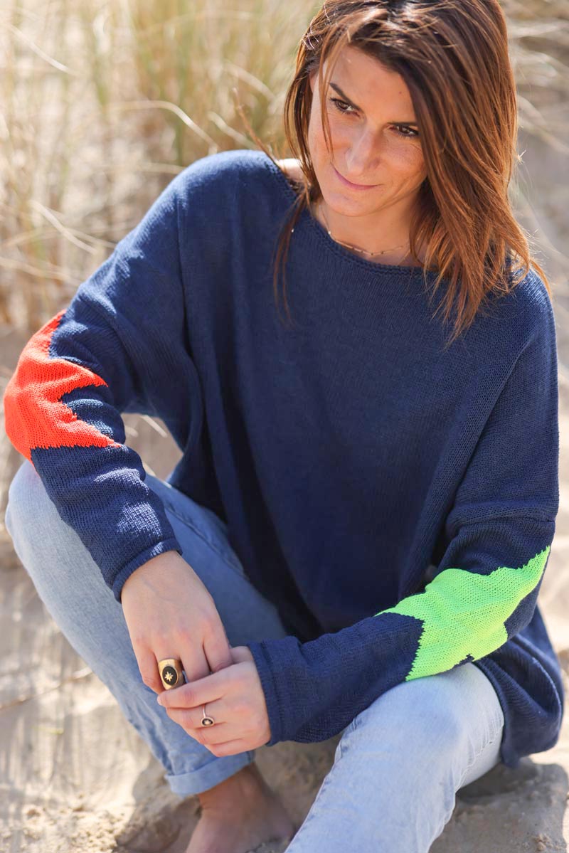 Navy blue knit sweater with colourful stars