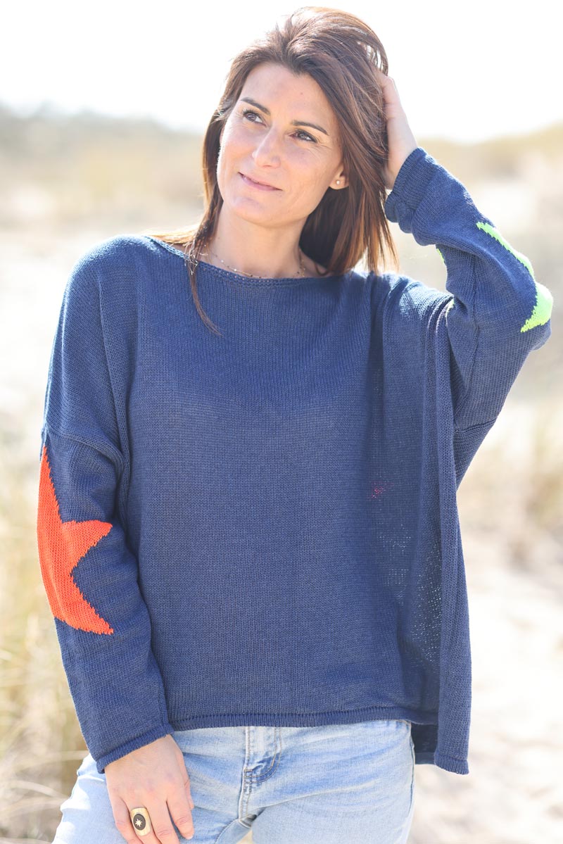 Navy blue knit sweater with colourful stars