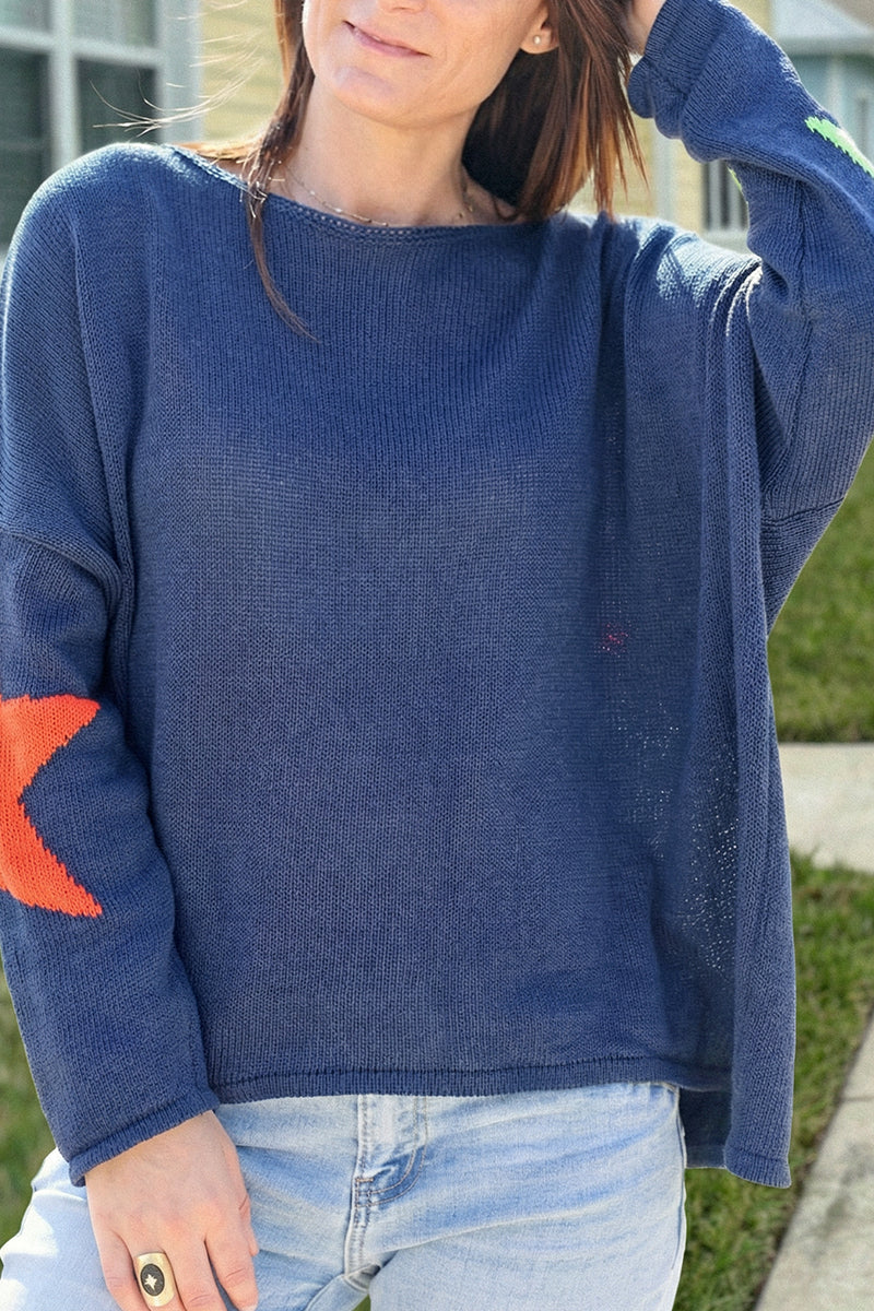 Navy blue knit sweater with colourful stars