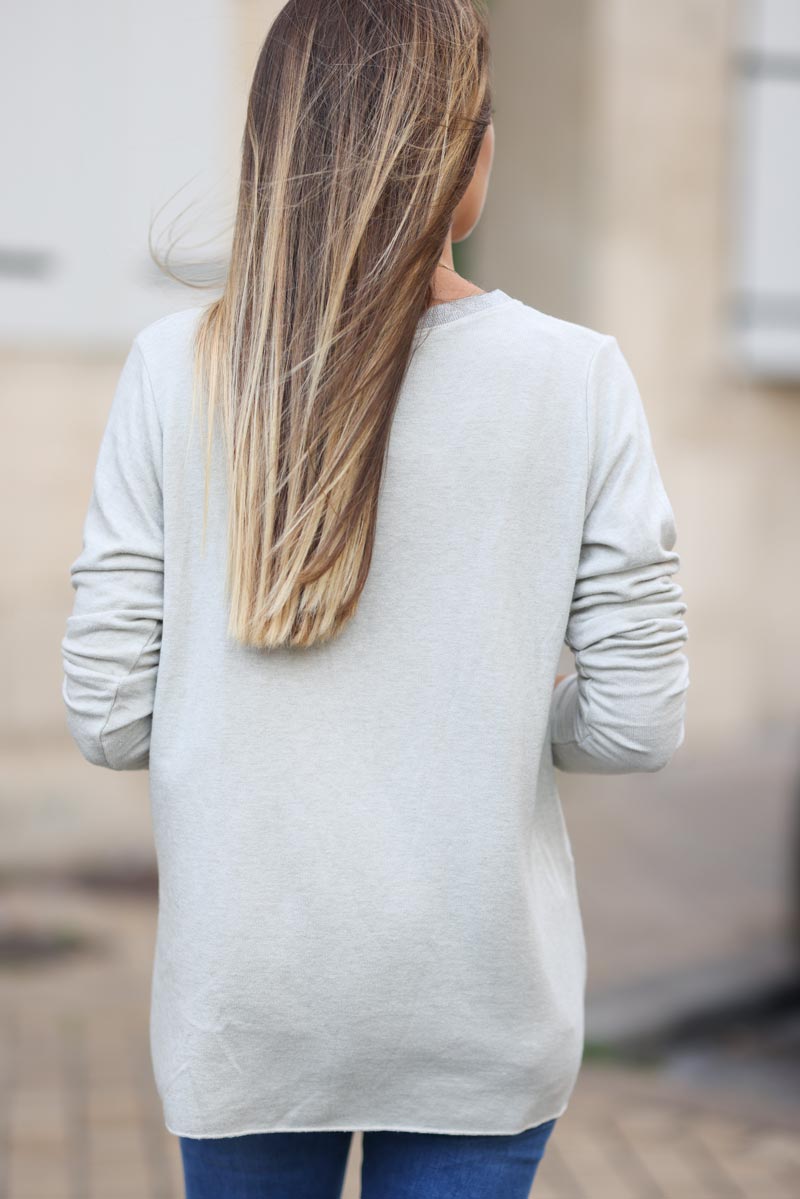 Pull jersey beige tout doux col v brillant H314 (1)