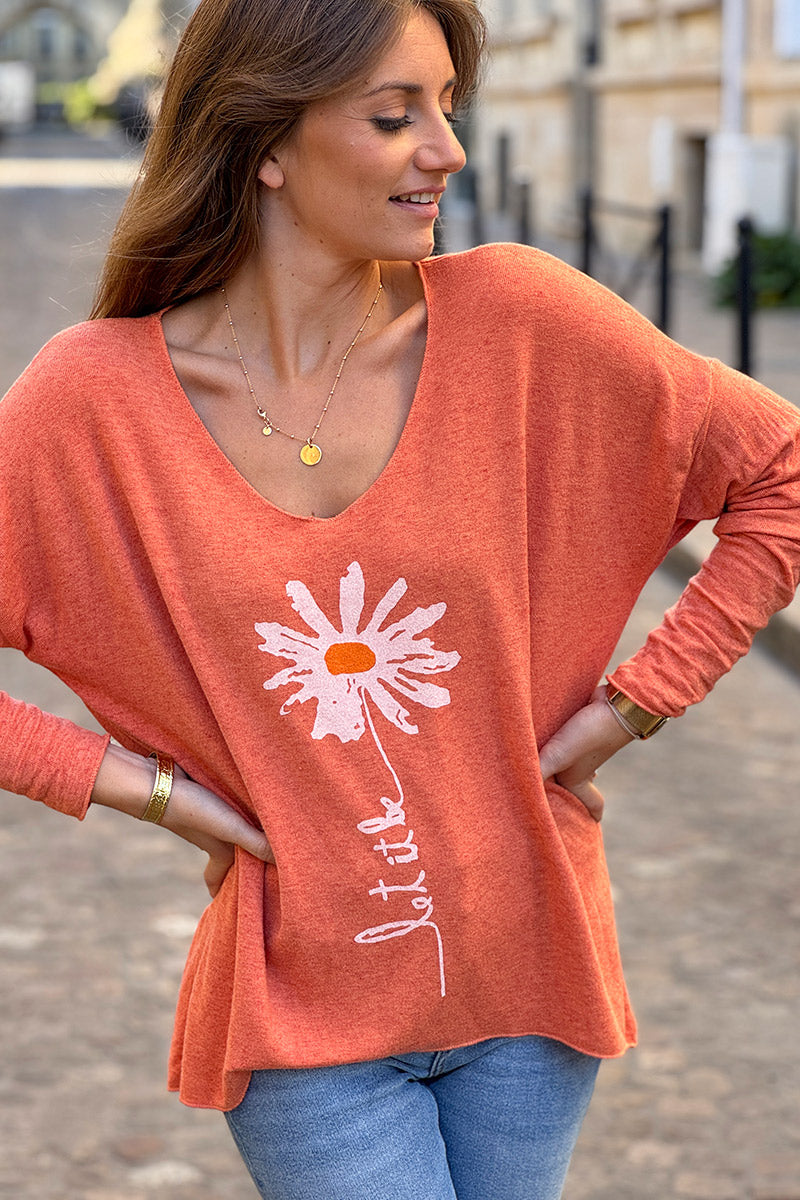 Pull jersey tout doux orange motif marguerite Let it be