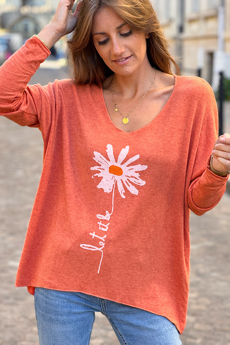 Pull jersey tout doux orange motif marguerite Let it be