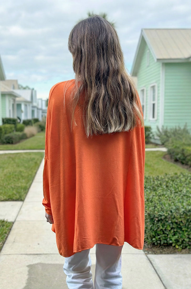 Pull large orange manches chauve souris