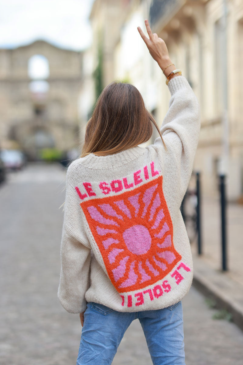 Beige chunky knit sweater with vibrant sun embroidery