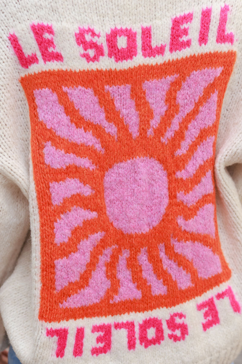 Beige chunky knit sweater with vibrant sun embroidery