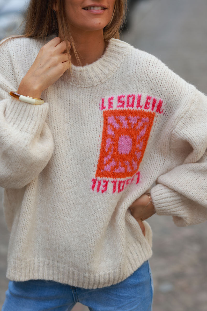 Beige chunky knit sweater with vibrant sun embroidery