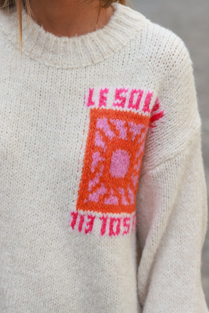 Beige chunky knit sweater with vibrant sun embroidery