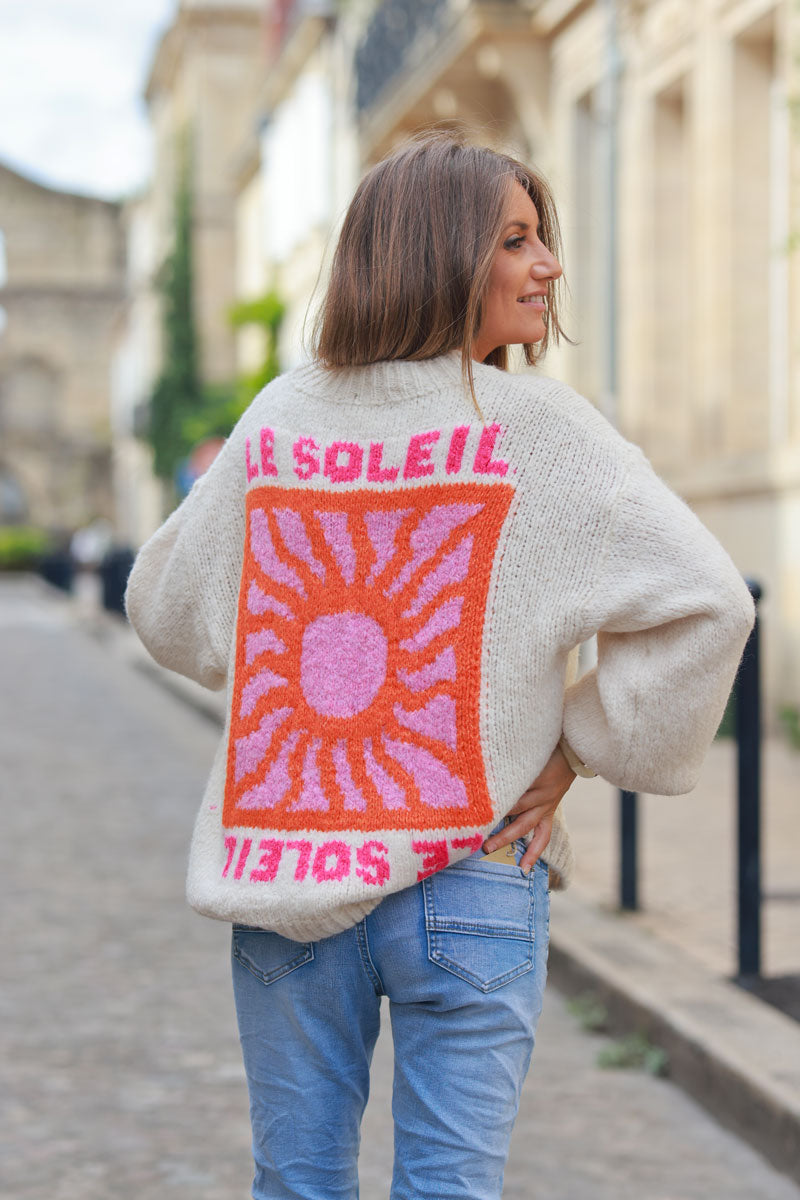 Beige chunky knit sweater with vibrant sun embroidery