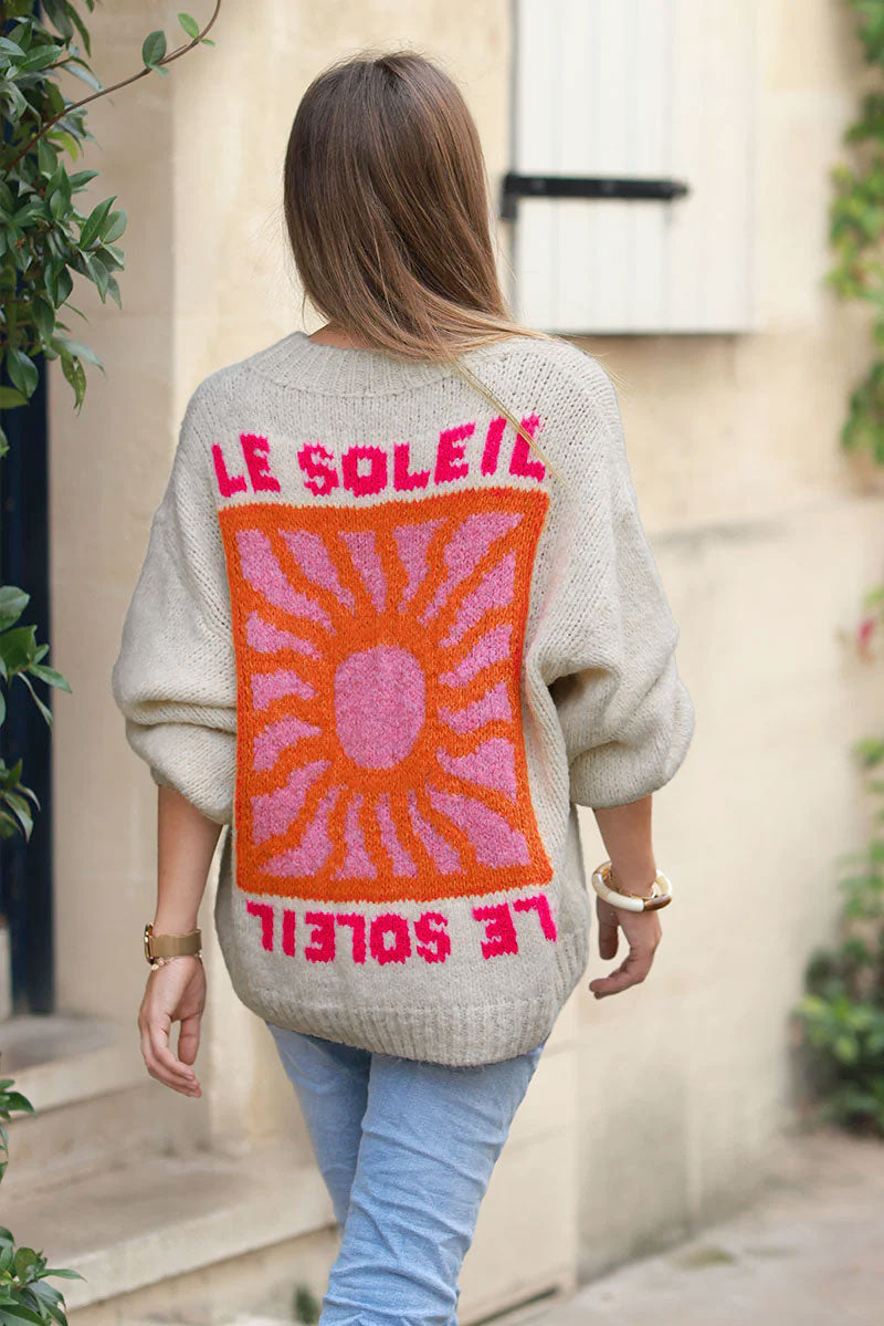 Beige chunky knit sweater with vibrant sun embroidery