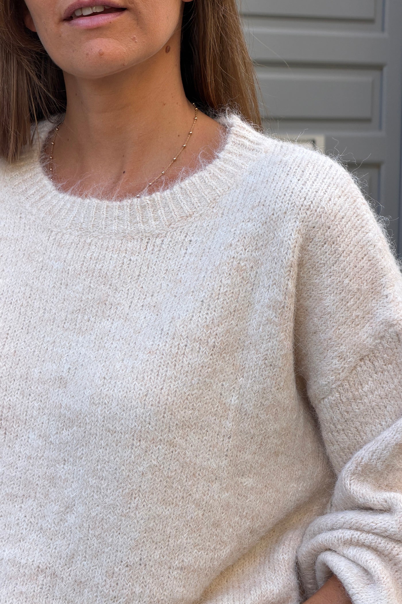 Pull moelleux beige chine col rond manches bouffantes