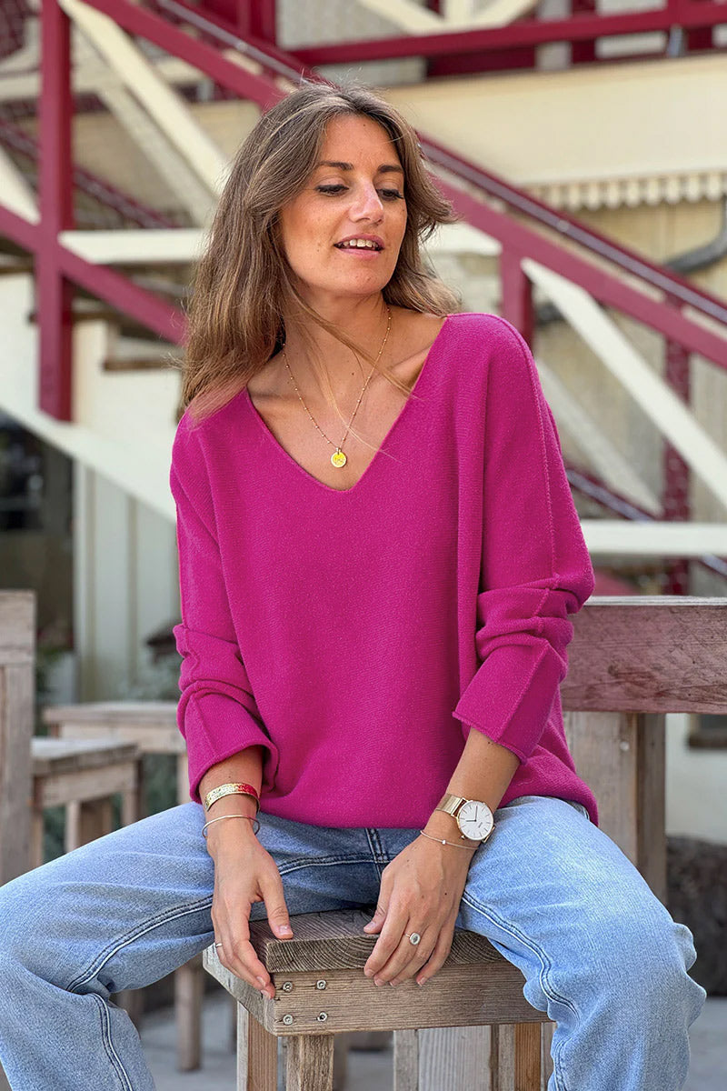 Suéter de cuello en V fucsia suave