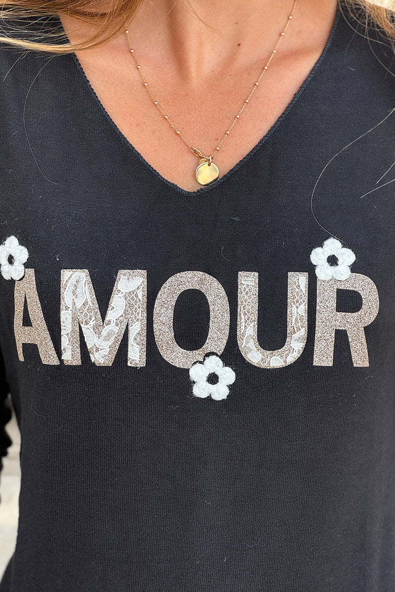 Pull noir en jersey doux Amour en paillettes dorées et fleurs bouclettes