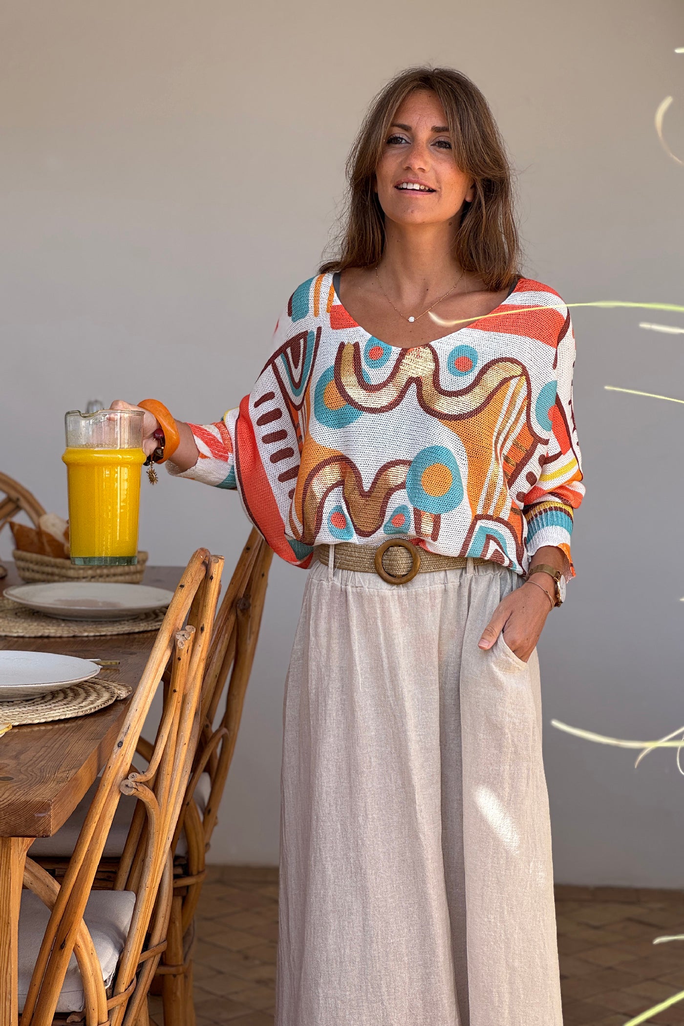 Pull petite maille imprime graphique abstrait tons orange manches chauve-souris