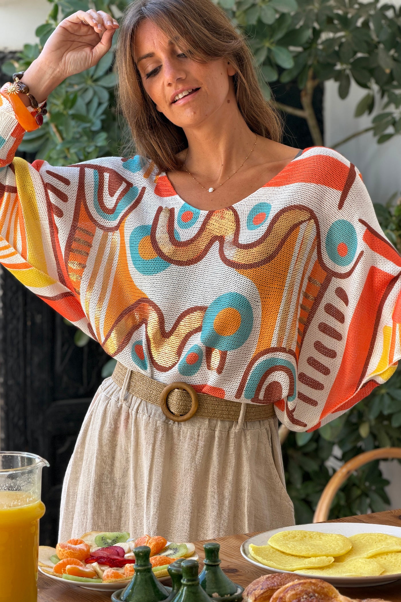 Pull petite maille imprime graphique abstrait tons orange manches chauve-souris